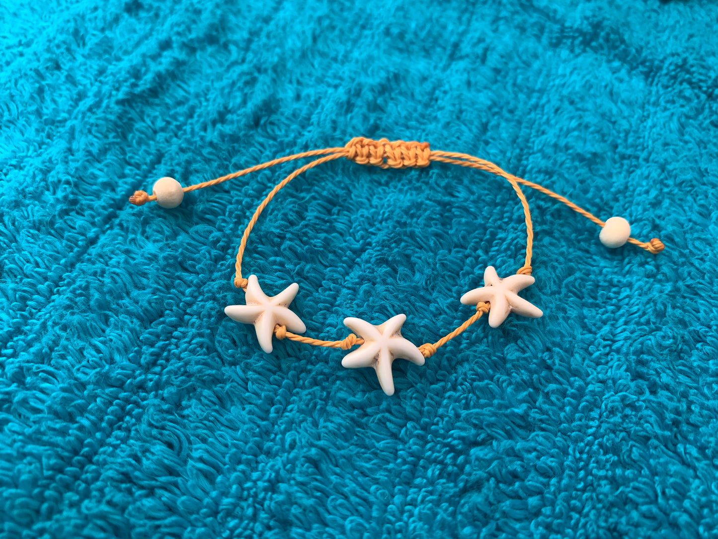 Single Strand Triple Starfish Wax Cord Bracelet