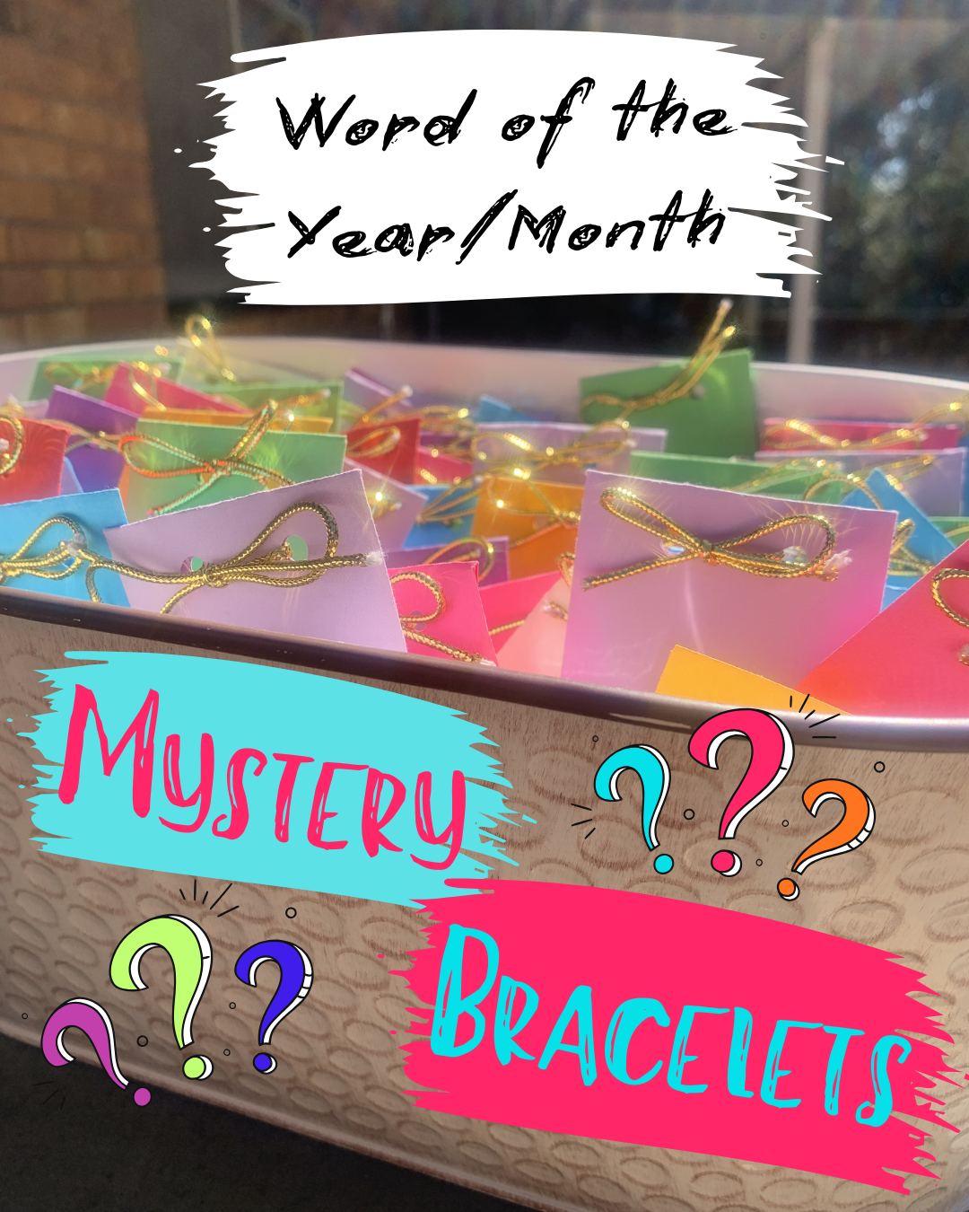 Container of colorful packets with gold bows with text overlay for a 'Word of the Year/Month Mystery Bracelet' promotion.